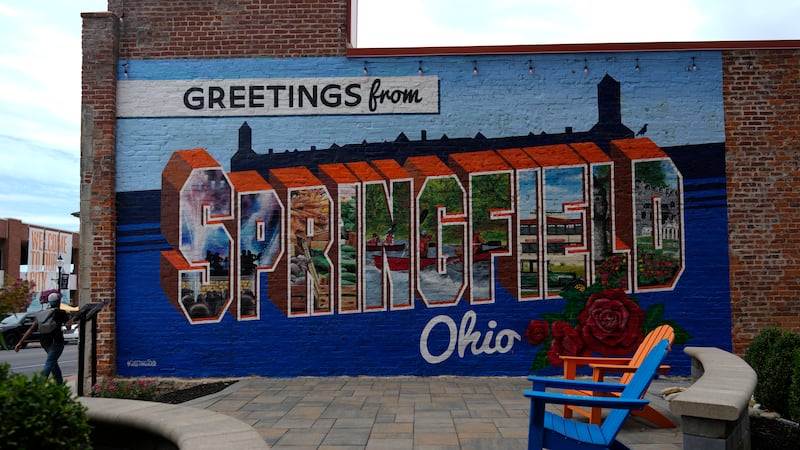 A mural that reads "Greetings from Springfield Ohio" is seen painted on an alley wall Tuesday,...