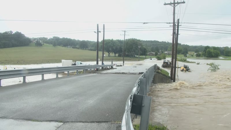 Residents in Lanesville, Ind., are taking shelter on the roofs of their homes Tuesday...