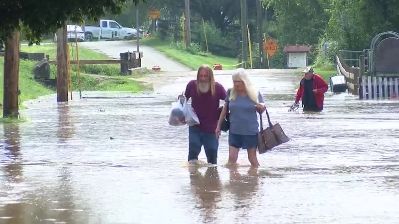 Residents in southeast Indiana are wading through floodwaters after historic rainfall left...